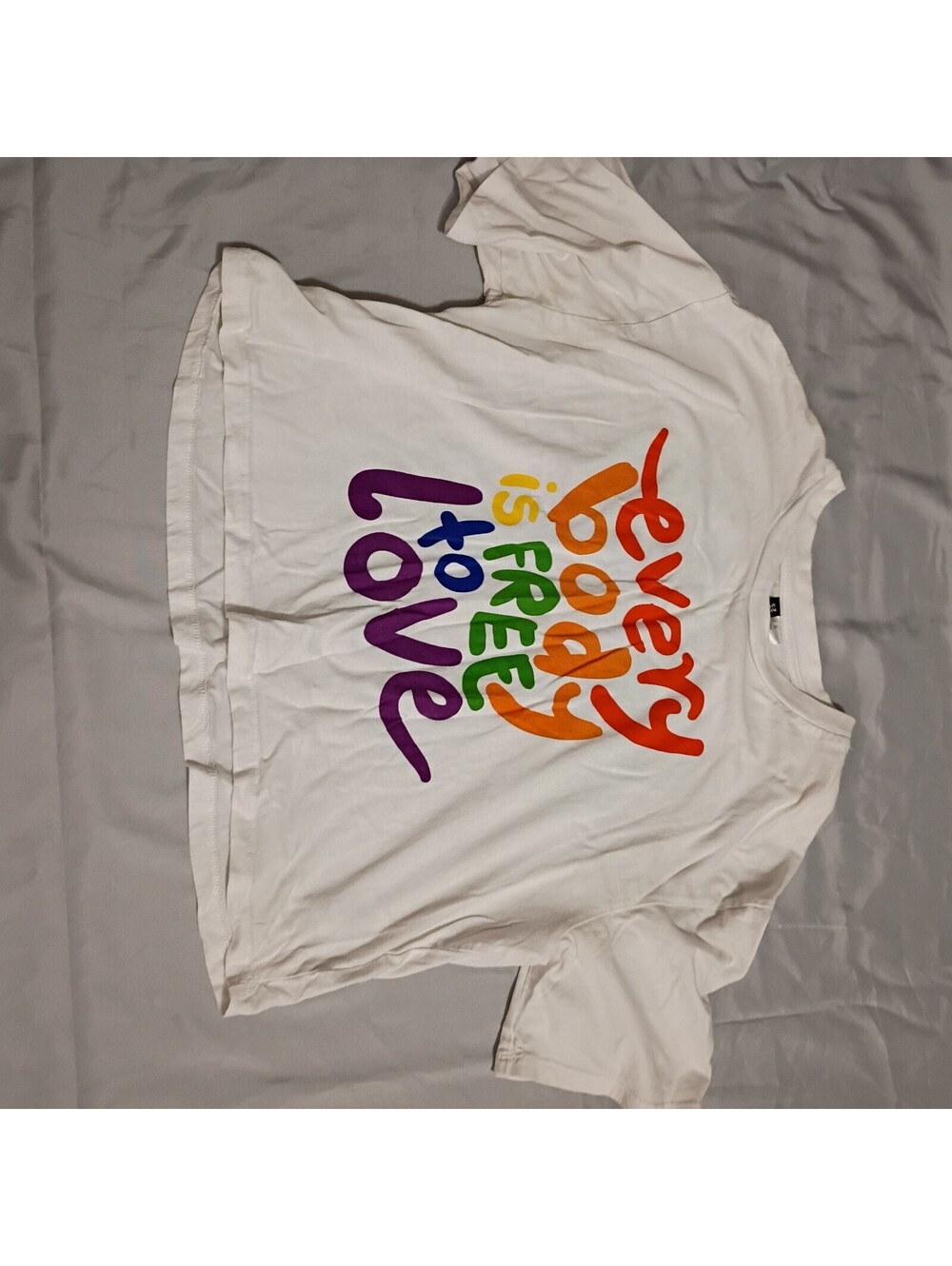 Divided White Graphic T-Shirt with Colorful Text